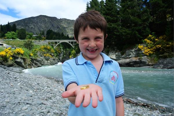 Jack Kennedy on the banks of the Shotover River at Arthurs Point with the ounce of gold worth $2300.